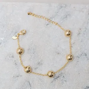 PULSEIRA BOLINHAS M LISAS BANHO OURO 18K