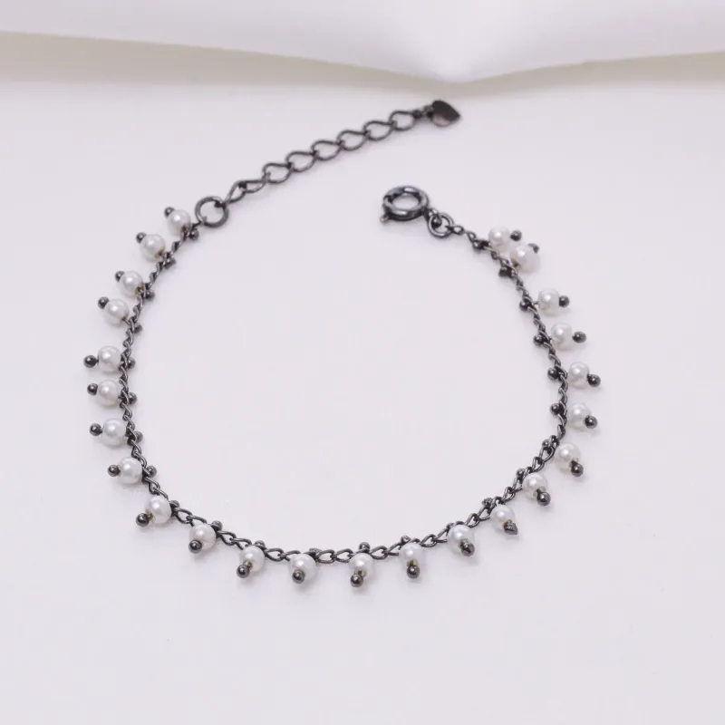 PULSEIRA COM PÉROLAS BANHO RÓDIO NEGRO