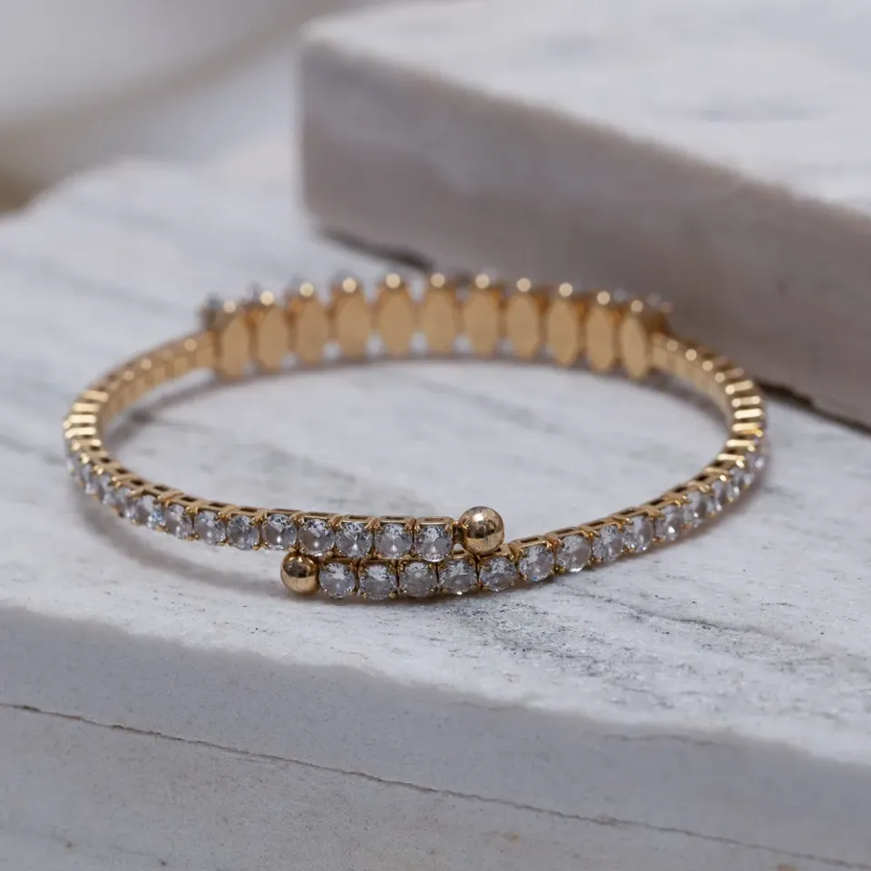 BRACELETE FLEXÍVEL CRAVEJADO COM ZIRCÔNIAS BANHO OURO 18K