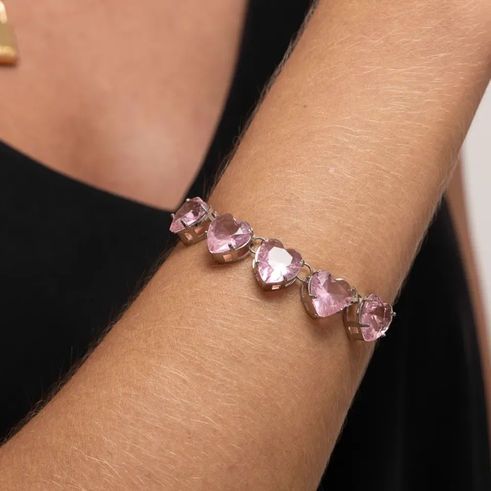 PULSEIRA GRAVATINHA CORAÇÃO COM PEDRAS ROSA CLARO BANHO RÓDIO BRANCO